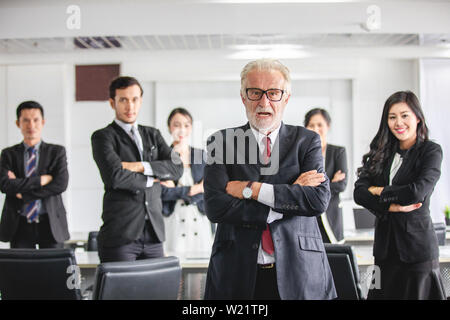 Group of business people with businessman leader celebrating success Achievement and smiling Stock Photo