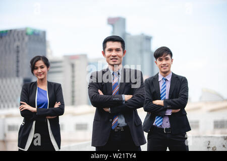 Group of business people with businessman leader celebrating success Achievement and smiling Stock Photo