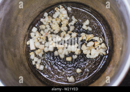 Pieces of raw lamb fat dumba are fried in a black cauldron, cooking food  Stock Photo - Alamy