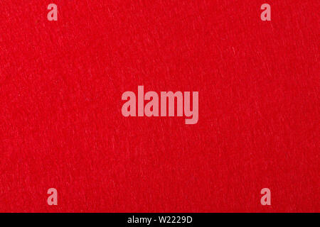 Felt background in red color useful for christmas texture. Stock Photo