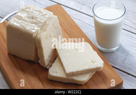 Sliced Tulum Cheese (Turkish: tulum peyniri) is a traditional Turkish goat's milk cheese ripened in a goatskin casing, called tulum in Turkish. Stock Photo