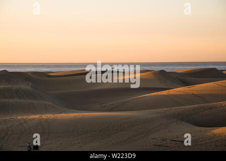 Dramatic morning lights on the beach with fishing pier Stock Photo