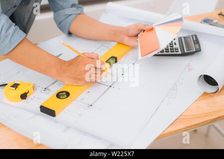 Workplace items tools for project, Architect or Engineer working on blueprint for architectural project in progress, construction and structure concep Stock Photo