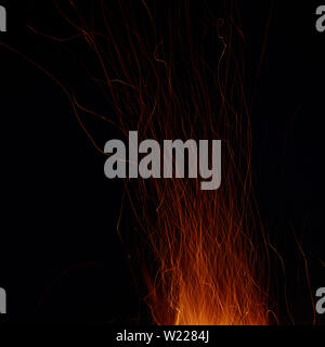 Abstract image of a fire sparks on a black background. Shot on a long exposure Stock Photo