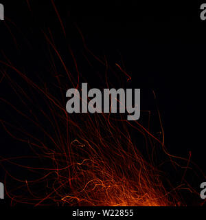 Abstract image of a fire sparks on a black background. Shot on a long exposure Stock Photo