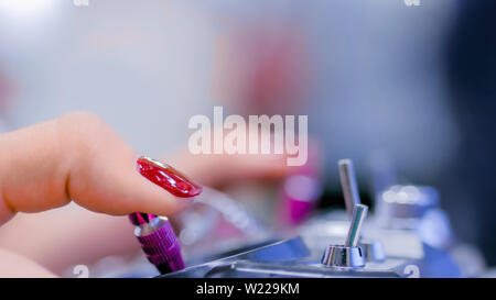 Woman using joystick or gamepad Stock Photo