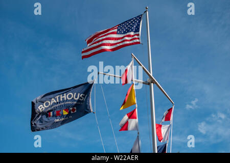 Orlando, Florida. June 15, 2019. Top view of USA Flag and Boathouse flag in Disney Springs at Lake Buena Vista . Stock Photo