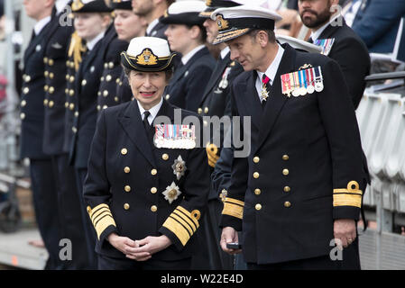 The Princess Royal and Rear Admiral John Weale (right) join serving Royal Navy submariners, veterans, families and support workers gather at HM Naval Base Clyde, the home of the UK Submarine Service at Faslane in Argyll and Bute, to mark 50 years of the Continuous At Sea Deterrent (CASD). Stock Photo
