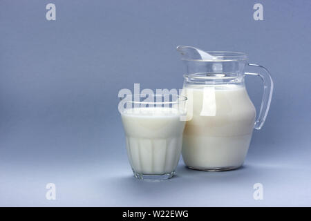 Jar and glass of milk isolated on white background with copy space for text, dairy product concept Stock Photo