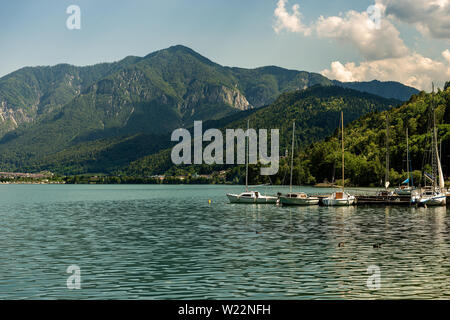 Sailboats in the Caldonazzo lake, Italian Alps, Valsugana valley, Trento province, Trentino Alto Adige, Italy, Europe Stock Photo
