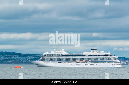 Firth of Forth, Scotland, United Kingdom, 5th July 2019. Viking Cruise Lines’ newest ocean cruise ship, the Norwegian Viking Jupiter, brings 930 tourists into Newhaven harbour in Edinburgh by tender across the Firth of Forth on a stormy day with choppy water Stock Photo