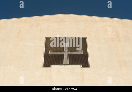 The cross above the entrance of the Guards Chapel in Wellington Barracks on birdcage Walk, London,UK. Stock Photo