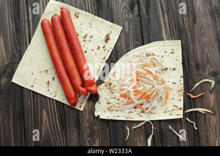 homemade sausage, pita bread and pickled cabbage for making Shawarma. Stock Photo