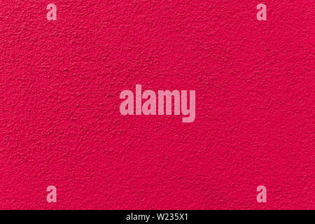 Pink painted cement wall, uneven concrete surface Stock Photo