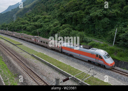 Taiwan Railway - TzeChiang Limited Express, a passing passenger train at speed, Xincheng Township, Hualien County, Taiwan Stock Photo