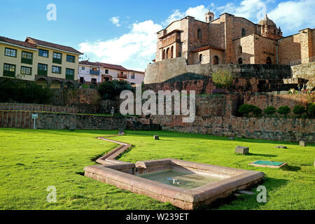 Temple of the Sun of the Incas or Coricancha with Convent of Santo Domingo Church above as seen from its courtyard, Cusco, Peru Stock Photo