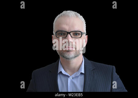Handsome young man in shirt expresses various emotions. isolate on black background Stock Photo