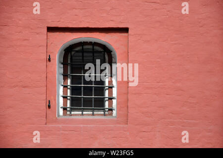 Antique brick wall with an arched window. Texture, copy-paste Stock Photo