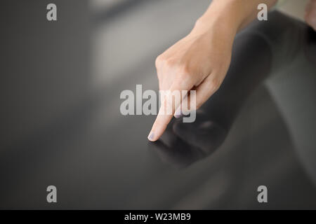 hand using black interactive panel Stock Photo