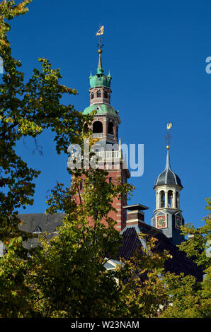 leer, niedersachsen/germany - may 17, 2015: view onto the towers of historical weigh house and city hall Stock Photo