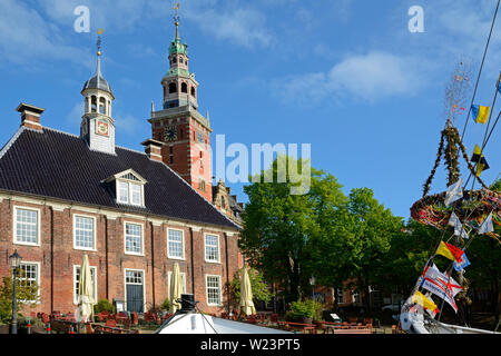 leer, niedersachsen/germany - may 17, 2015: view onto historical weigh house and city hall next to the historic port at a sunny spring day Stock Photo