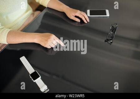 close up of woman using black interactive panel Stock Photo