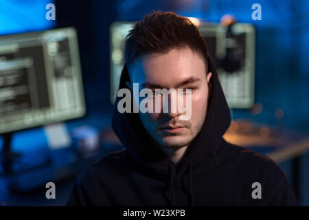 asian hacker in dark room with computers at night Stock Photo