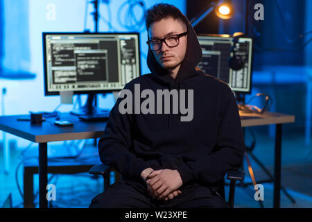 asian hacker in dark room with computers at night Stock Photo