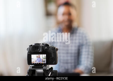 camera recording video blog of indian male blogger Stock Photo
