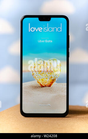 Love Island TV show - logo on the smartphone screen.