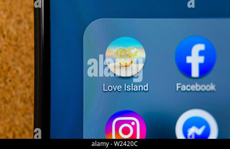 Love Island TV show mobile app icon on the smartphone screen.