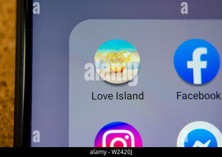 Love Island TV show mobile app icon on the smartphone screen.