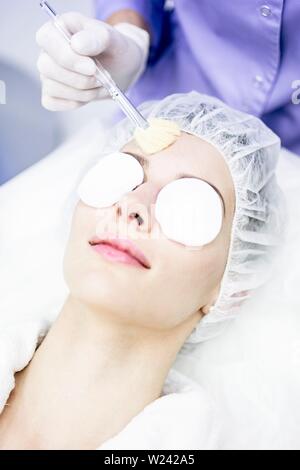 Dermatologist cleaning face after microdermabrasion treatment in clinic, close-up. Stock Photo