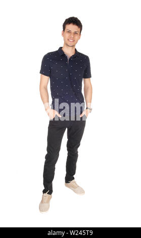 A good looking young man in black clothing standing in the studio, resting and smiling, isolated for white background Stock Photo
