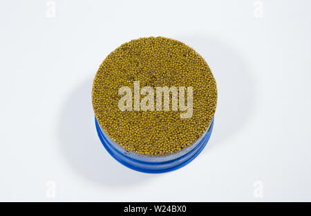 Exquisite caviar on a white background in a jar. Stock Photo