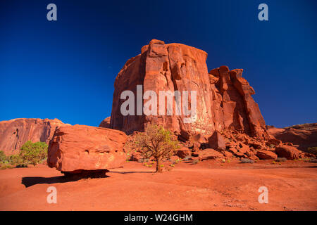 Monument Valley. Navajo Tribal Park. Red rocks and mountains. Located on the Arizona–Utah border. USA. Stock Photo