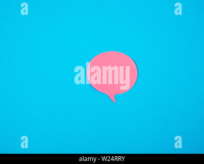 pink sticker in the shape of a cloud on a blue background, copy space Stock Photo