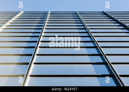 Office building windows in square grid pattern in perspective looking up. Stock Photo
