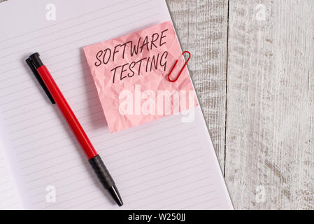 Text sign showing Software Testing. Business photo text investigation provide information about the quality of it Wrinkle paper and notebook plus stat Stock Photo