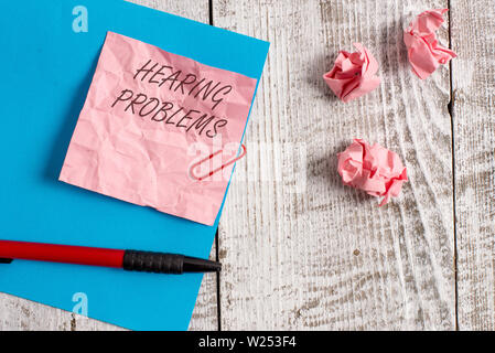 Handwriting text writing Hearing Problems. Conceptual photo is partial or total inability tolisten to sounds normally Wrinkle paper and cardboard plus Stock Photo