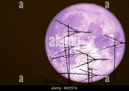 full crow moon back on silhouette atenna on night sky, Elements of this image furnished by NASA Stock Photo