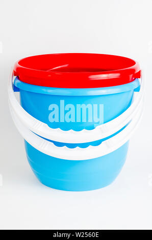 Two empty pink buckets isolated over white Stock Photo - Alamy