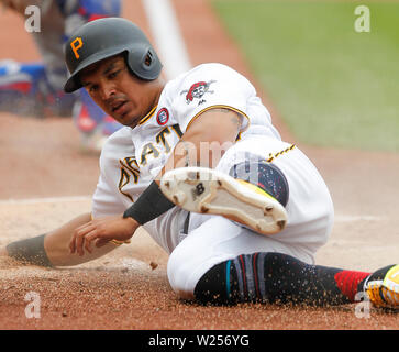 Pittsburgh, Pennsylvania, USA. 4th July, 2019. Pittsburgh Pirates third baseman Jose Osuna (36) slides safely to the plate to score the Pirates first run of the game after a double by Pittsburgh Pirates shortstop Jung Ho Kang (16) in the bottom of the 2nd inning in the Major League Baseball game between the Chicago Cubs and Pittsburgh Pirates at PNC Park, in Pittsburgh, Pennsylvania. (Photo Credit: Nicholas T. LoVerde/Cal Sport Media) Credit: csm/Alamy Live News Stock Photo