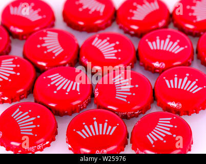 Kamchatka, Russia - 19 May 2018: Red beer caps Bud. From Anheuser-Busch InBev, Budweiser and Bud Light are top selling domestic beers in the United St Stock Photo