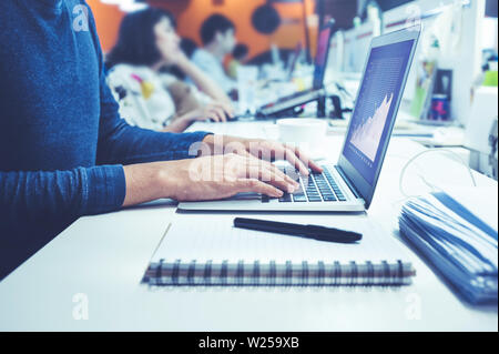 Male using computer laptop in office.business lifestyle and organization concepts Stock Photo
