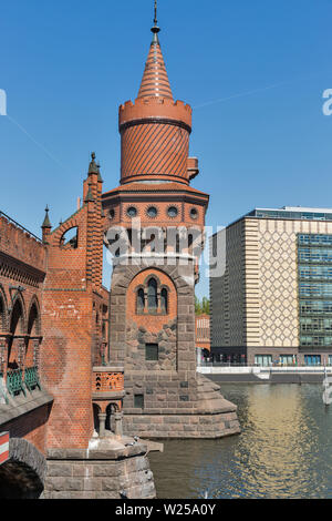 Tower of Oberbaum bridge over Spree River in Berlin, Germany. Stock Photo