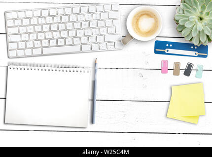 top view of clean modern office workspace, wooden desk with computer keyboard, notepad, coffee mug and office supplies Stock Photo