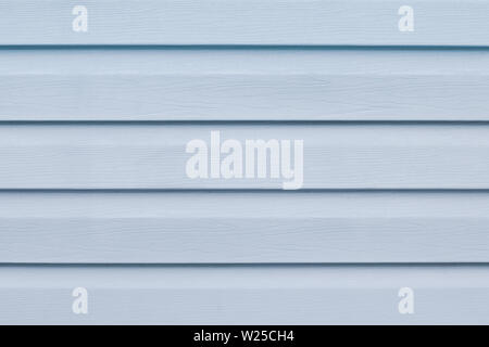 Gray blue wooden table in lines. Striped panel, surface, background. Soft grey wooden slats texture. Plank - timber. Light blue painted wood boards. A Stock Photo