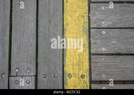 Old weathered wooden boardwalk in Southport, UK Stock Photo