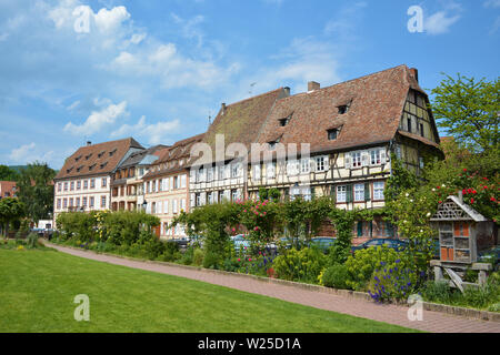 Small park without people with view on beautiful traditional European styletimber framing houses in city center of Wissembourg in France Stock Photo